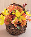 
A twiggy harvest basket holds yellow Asiatic lilies and peach roses, peach alstroemeria and butterscotch daisy pompons with burgundy eucalyptus and wheat stems - all the sensational colors of Fall...
			