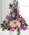 
This exquisite altar piece holds vivid jewel-tone blossoms...
			