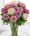 
A delightful study in pastels, this collection of pale pink roses, blush roses, pale yellow roses and pale lavender roses makes an exquisite bouquet...
			