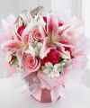 
Stargazer lilies steal the show in this exquisite bouquet, with hot pink roses and mini carnations and white alstroemeria as the supporting cast...
			