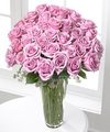 
An enchanting bouquet of three dozen lavender roses sweetly touches her heart...
			
