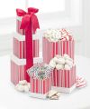 
A marvelous gourmet tower full of peppermint treats! Three beautiful gift boxes are filled with White Chocolate Covered Pretzels, Ghirardelli Dark Chocolate Peppermint Bark, White Chocolate Snowdrops...
			