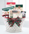 
A white tin basket packed with Key Lime Thimble Cookies, chocolate cream-filled wafers, a Brent & Sam's Chocolate Chunk Cookie, Biscottie Brothers Almond Biscotti, Bonne Maman Preserves, Ahmad Tea Eng...
			