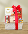 
Overflowing with chocolates and other tasty treats, this basket holds something for everyone...
			