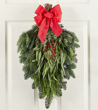Swag with red berries and bow - FedEx